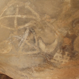 Cave painting at the Dhawaale site in northwestern Somalia featuring a cross-in-circle design. This artistic pattern has been found on pottery belonging to the C-Group culture, an ancient Afro-Asiatic-speaking population of Nubia.