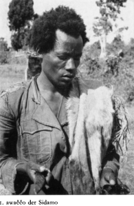A Sidamo man of mixed Cushitic and South Omotic ancestry. The South Omotic or Ari-like forager influence is particularly evident in the kinky hair texture and broader/flatter nasal bones and cartilage, as well as what Carleton Coon refers to as "an enlargement of both sagittal and lateral diameters of the face."