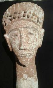 One of the realistic limestone sculptures from the second batch of ancient Puntite statues, excavated near Berbera in northwestern Somalia. The figure has the same phlegmatic expression, long face and "Caucasoid" features as the Gol Waraabe statues. He is also wearing an ornate headdress, which possibly indicates that he is royalty.