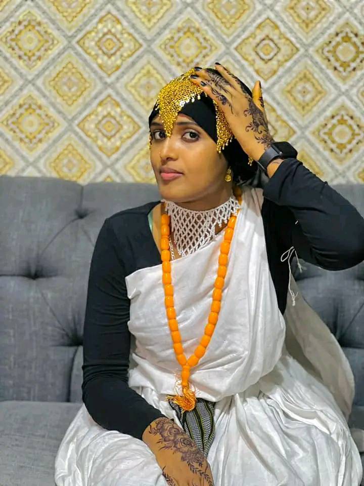 An Oromo woman with traditional henna patterns on her hands.
